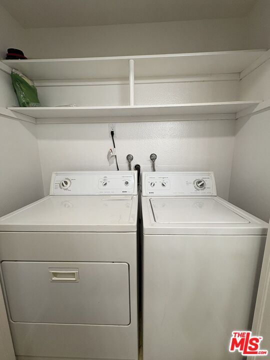 8162 Manitoba Street, Unit 111 Playa del Rey, CA 90293 - Photo 14 of 17 a utility room with dryer and washer