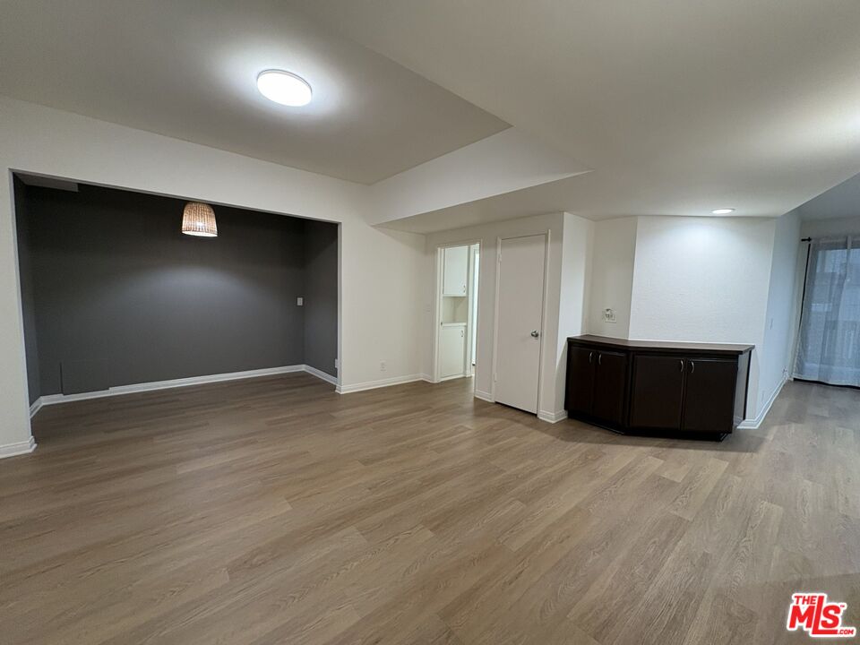 8162 Manitoba Street, Unit 111 Playa del Rey, CA 90293 - Photo 4 of 17 a view of an empty room with wooden floor