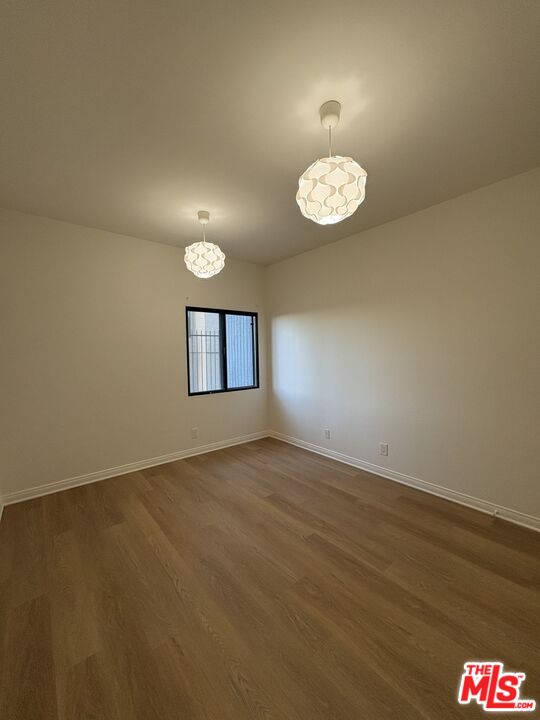 8162 Manitoba Street, Unit 111 Playa del Rey, CA 90293 - Photo 8 of 17 an empty room with a fan