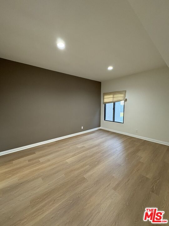 8162 Manitoba Street, Unit 111 Playa del Rey, CA 90293 - Photo 10 of 17 a view of empty room with wooden floor