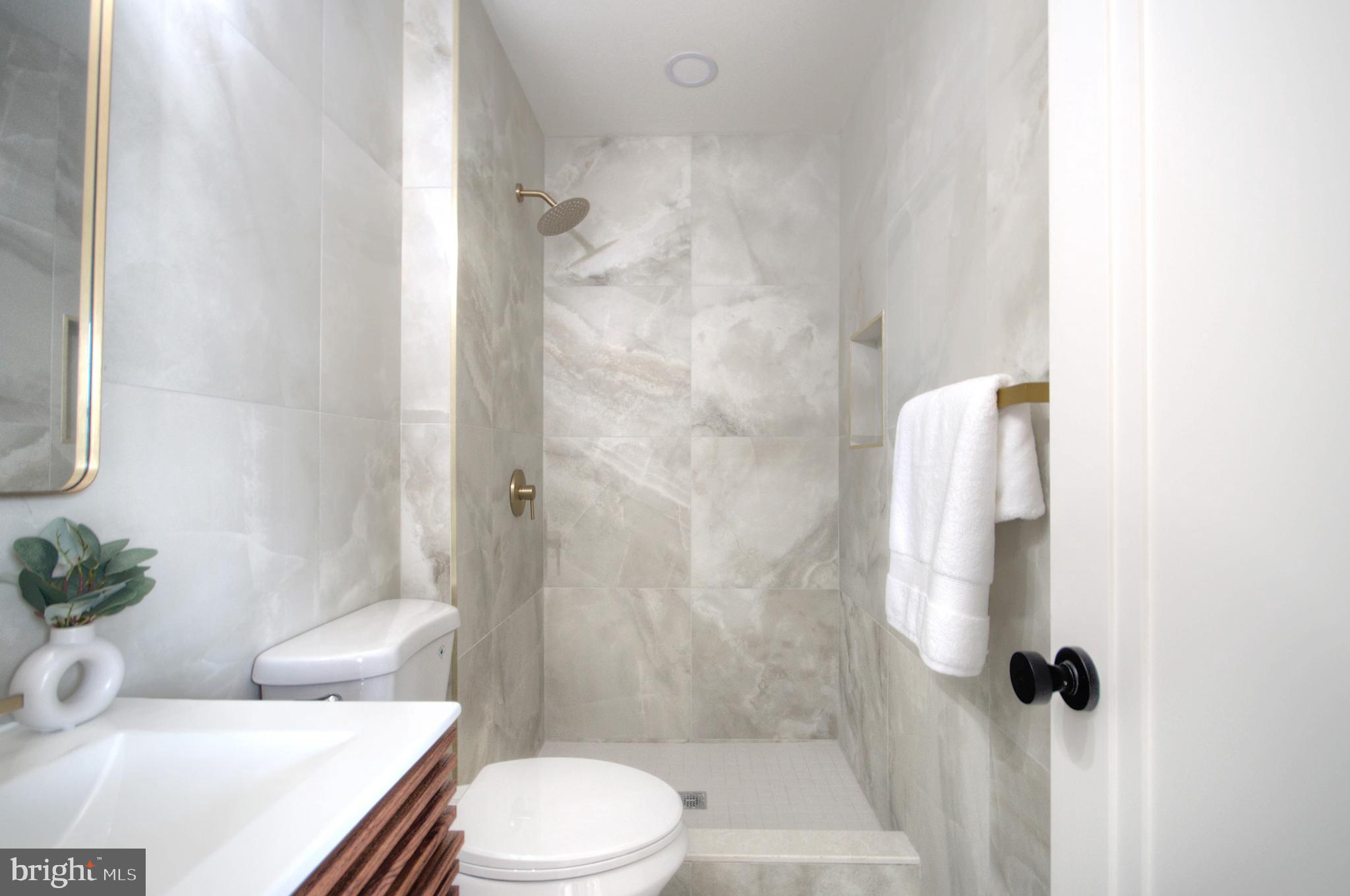 921 North Beecham Road Williamstown, NJ 08094 - Photo 29 of 43 a white toilet sitting next to a bathroom sink