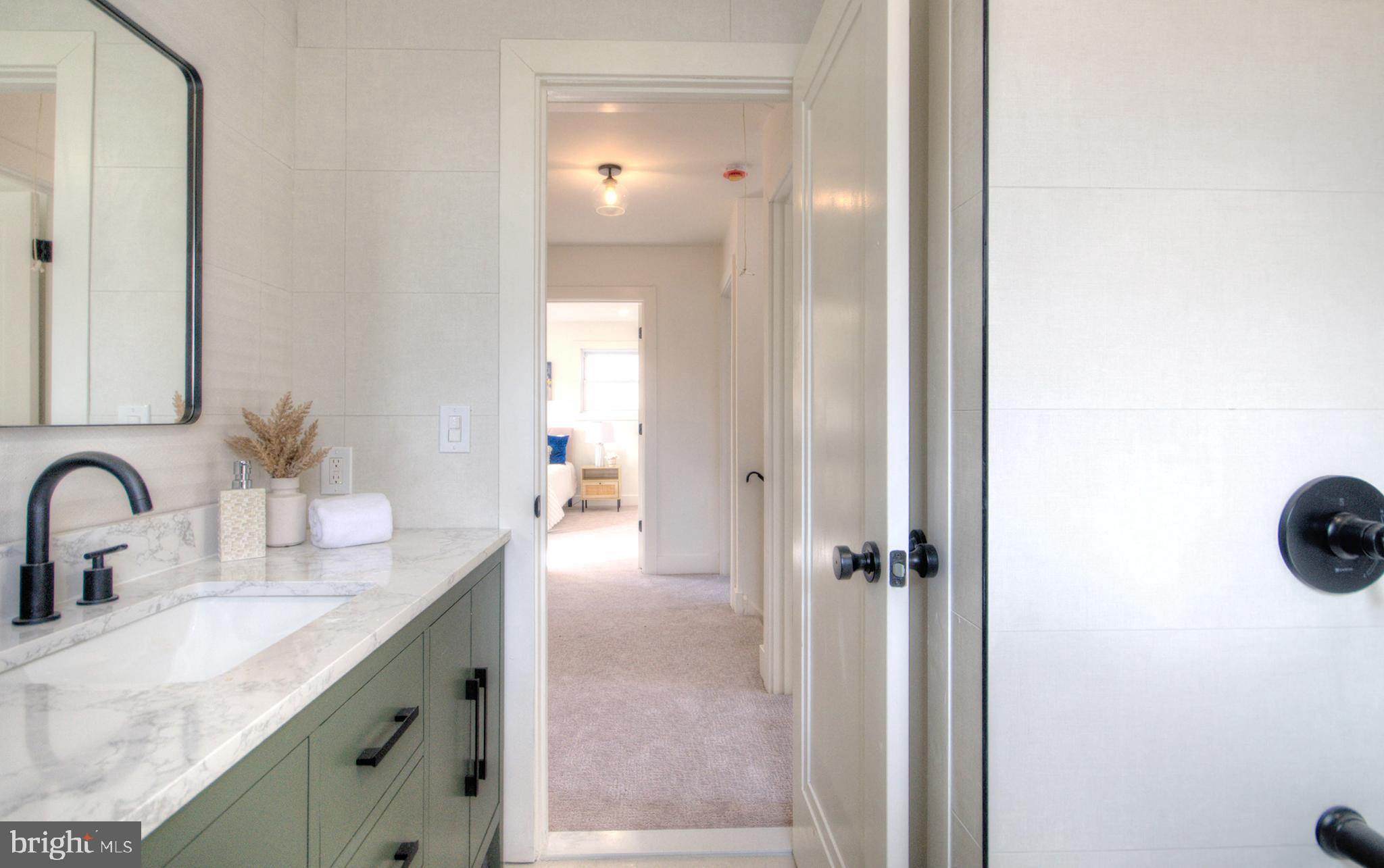 921 North Beecham Road Williamstown, NJ 08094 - Photo 35 of 43 a bathroom with a sink and a mirror