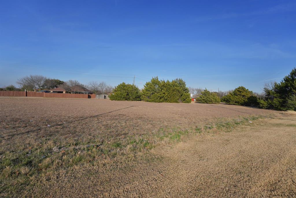 517 East Belt Line Road Cedar Hill, TX 75104 - Photo 9 of 14 a view of dirt field and trees