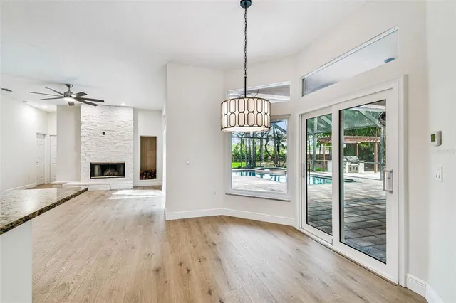a bathroom with a granite countertop tub sink and mirror