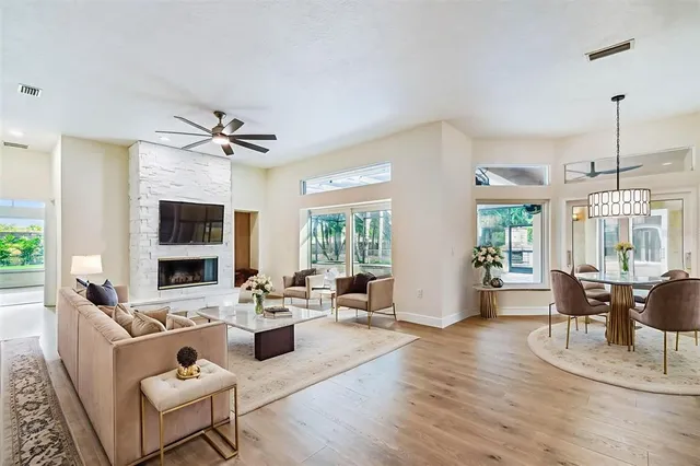 a view of a swimming pool with a patio and a yard