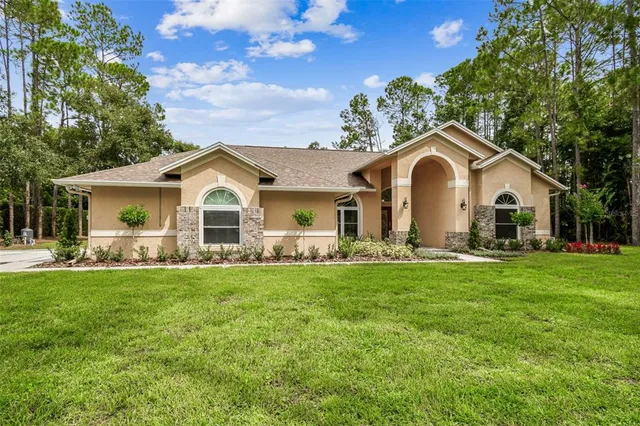 a kitchen with granite countertop a sink and a stove top oven
