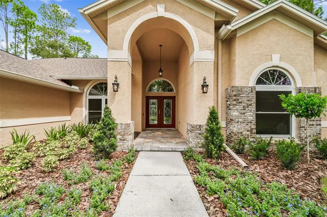 a kitchen with stainless steel appliances granite countertop a stove and a sink