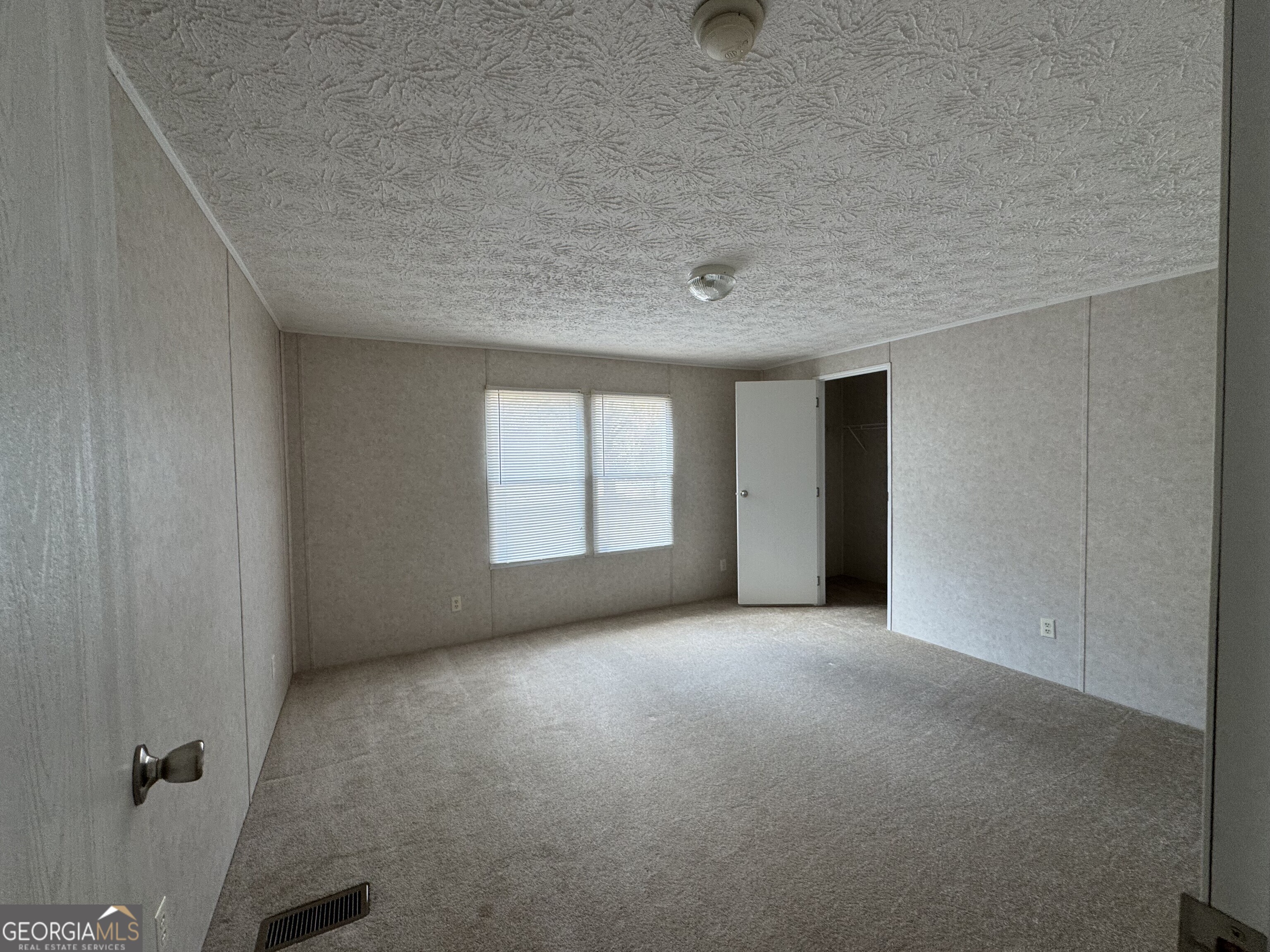 2278 Providence Church Road Lavonia, GA 30553 - Photo 5 of 16 an empty room with windows