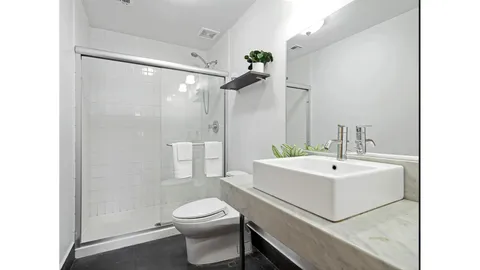 a bedroom with bed and window