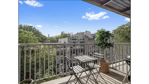 a kitchen with stainless steel appliances granite countertop a refrigerator a stove a sink dishwasher and a refrigerator with wooden floor