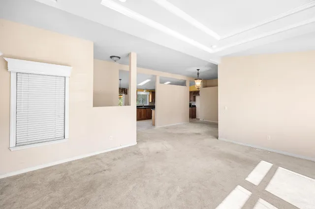 a kitchen with stainless steel appliances granite countertop a stove and cabinets