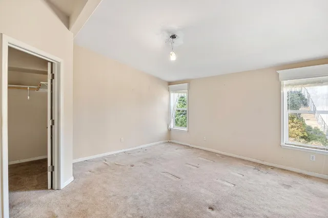 a view of a garage with wooden table and chairs