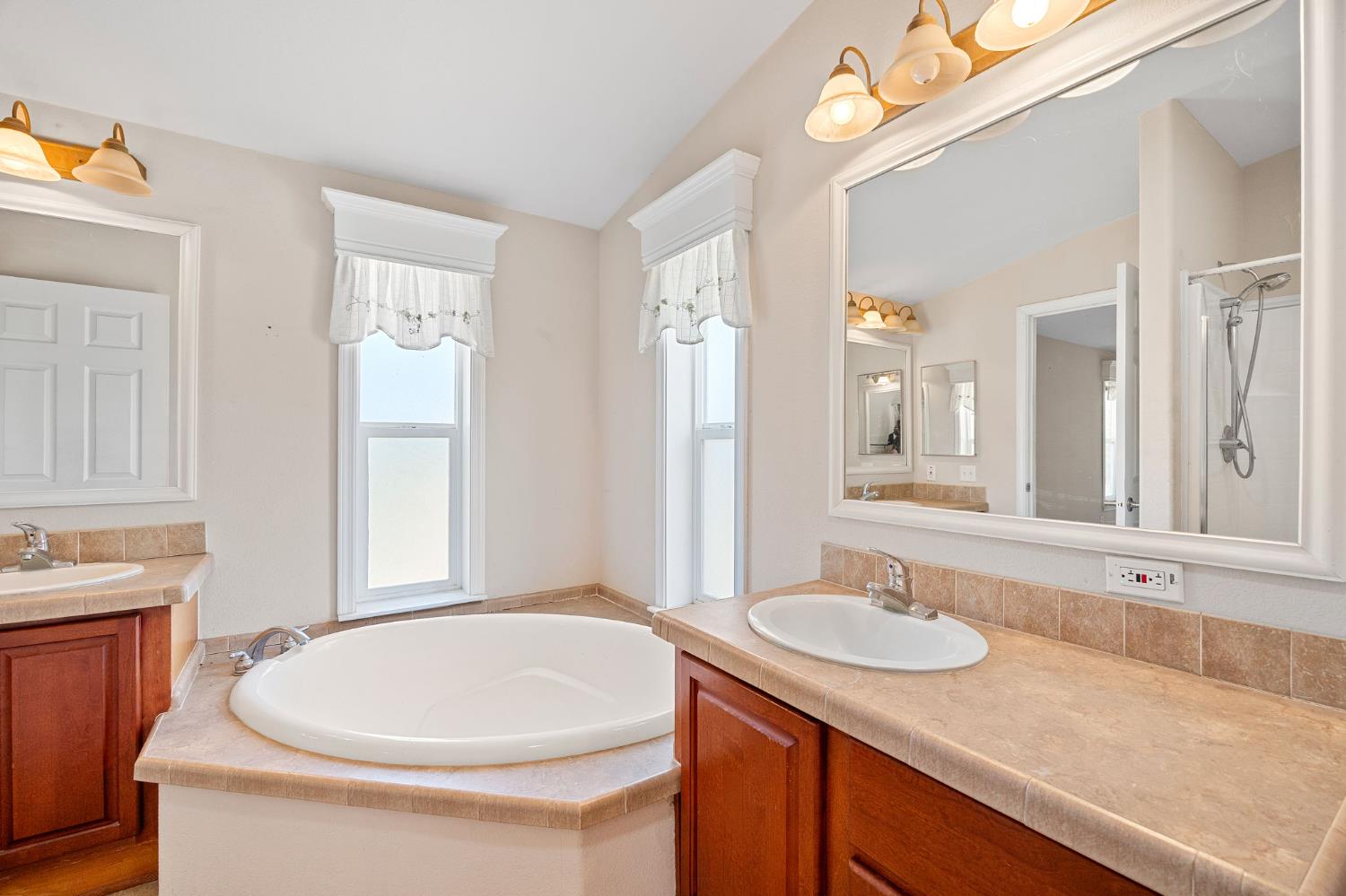 2970 Texas Hill Road Placerville, CA 95667 - Photo 31 of 46 a bathroom with a granite countertop sink toilet and a mirror