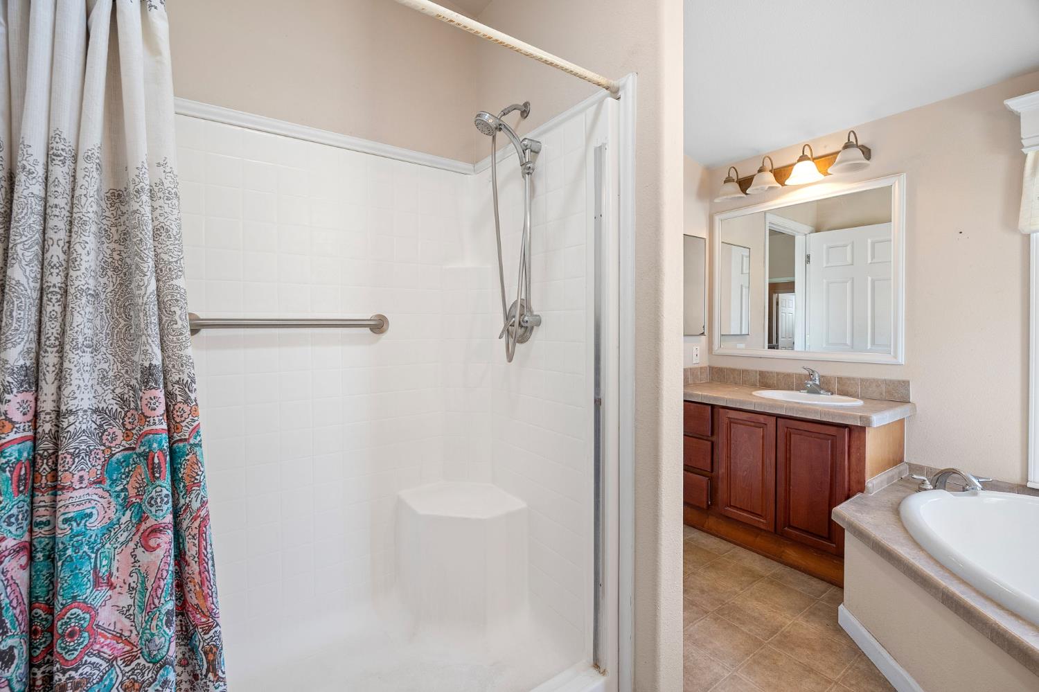 2970 Texas Hill Road Placerville, CA 95667 - Photo 8 of 46 a bathroom with a tub sink mirror and a shower