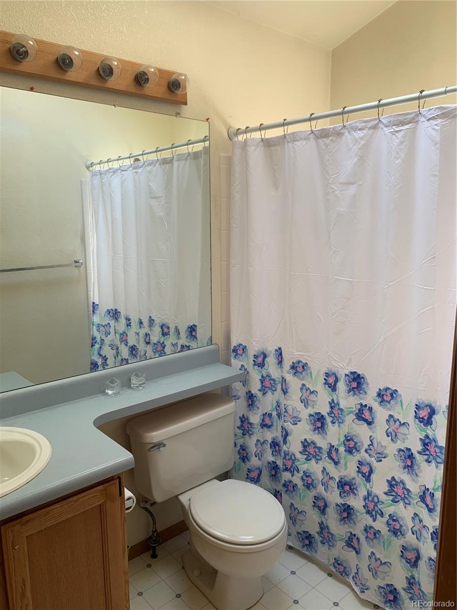 1187 West 133rd Way Westminster, CO 80234 - Photo 8 of 10 a bathroom with a sink toilet and shower