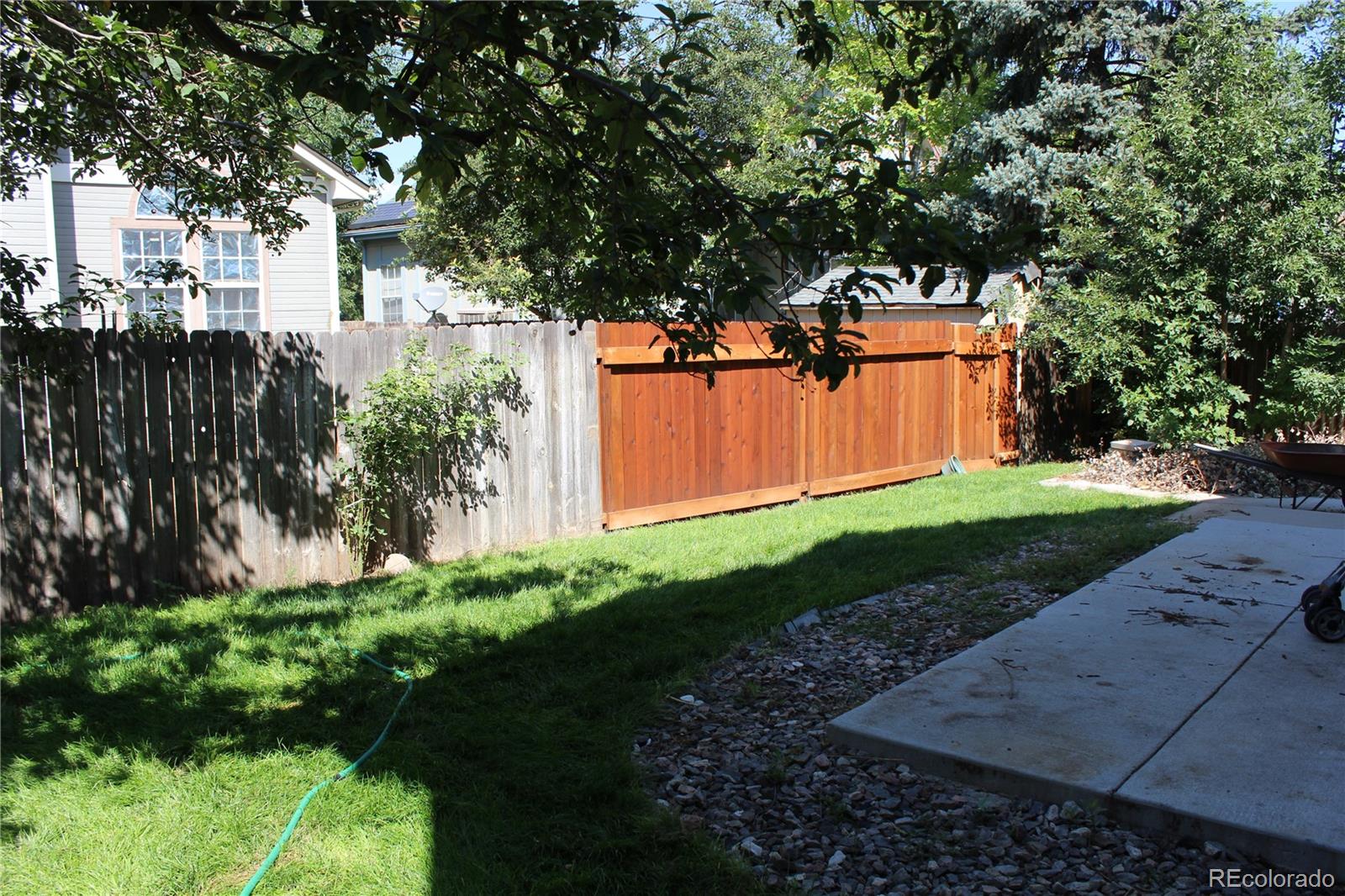 1187 West 133rd Way Westminster, CO 80234 - Photo 10 of 10 a backyard of a house with a garden