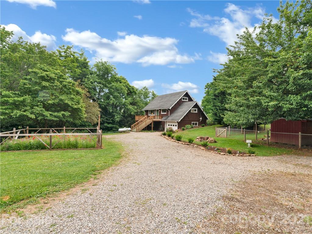 920 Hall Top Road Waynesville, NC 28786 - Photo 2 of 36 a house with a yard and a trees