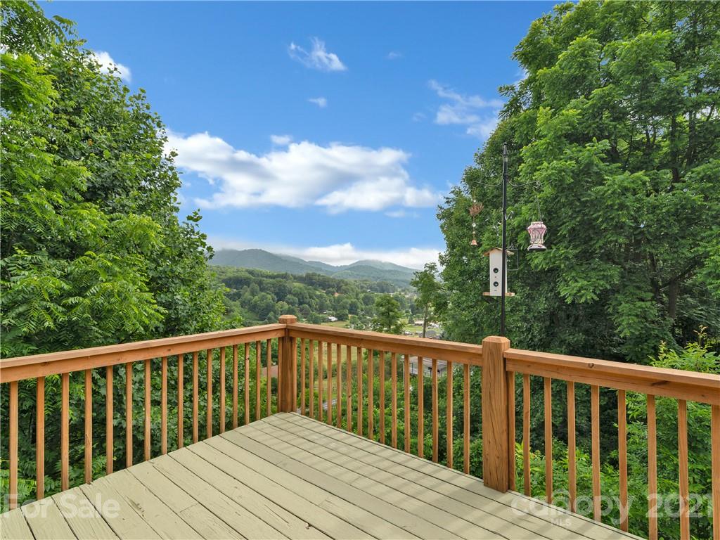 920 Hall Top Road Waynesville, NC 28786 - Photo 11 of 36 a view of balcony with wooden floor and fence