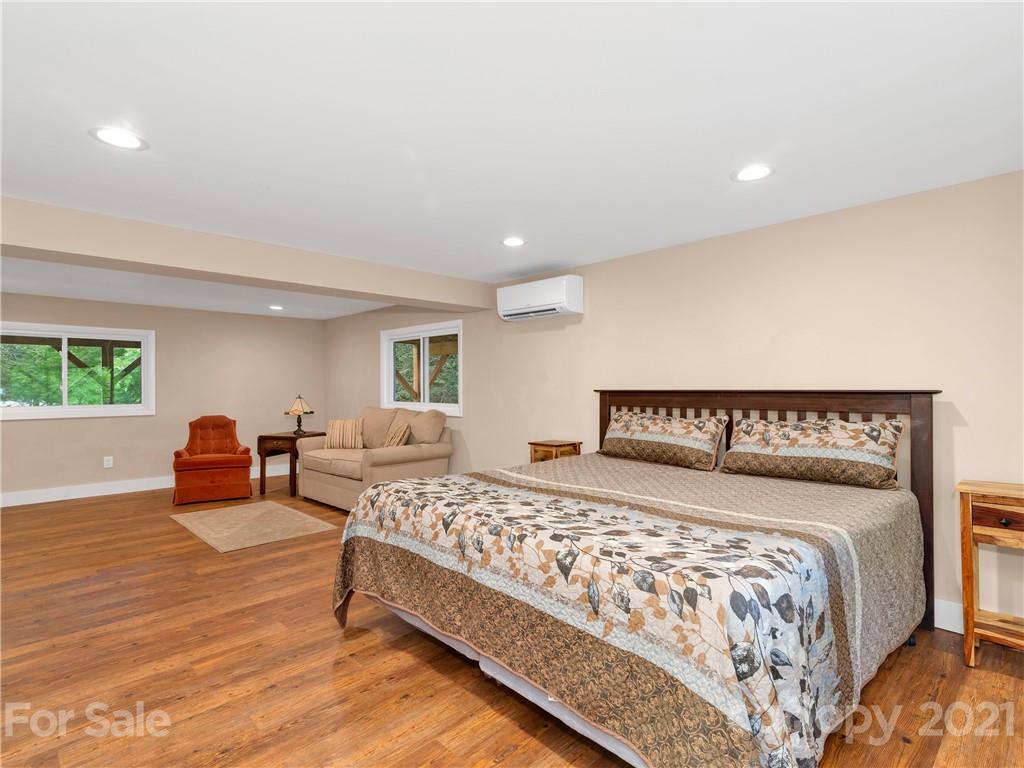 920 Hall Top Road Waynesville, NC 28786 - Photo 25 of 36 a bedroom with double bed and a large window