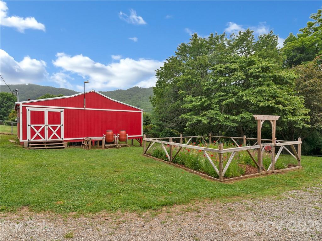 920 Hall Top Road Waynesville, NC 28786 - Photo 30 of 36 a view of a swimming pool with a yard