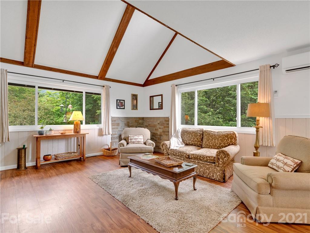 920 Hall Top Road Waynesville, NC 28786 - Photo 5 of 36 a living room with furniture and a large window