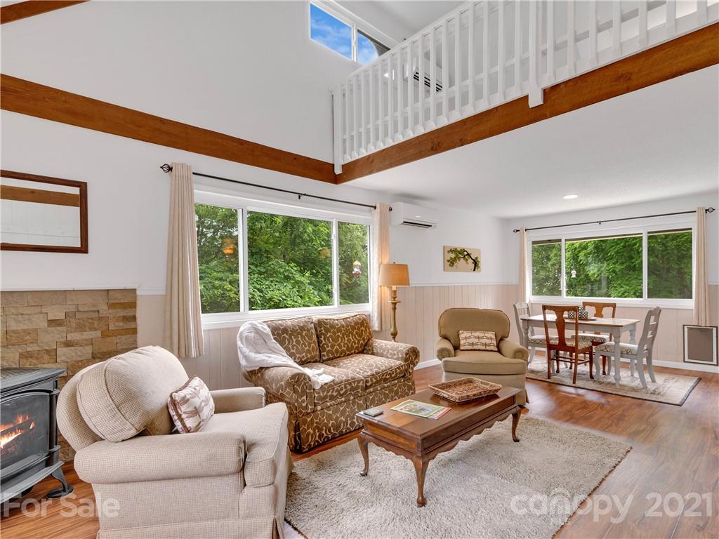 920 Hall Top Road Waynesville, NC 28786 - Photo 7 of 36 a living room with furniture and a large window