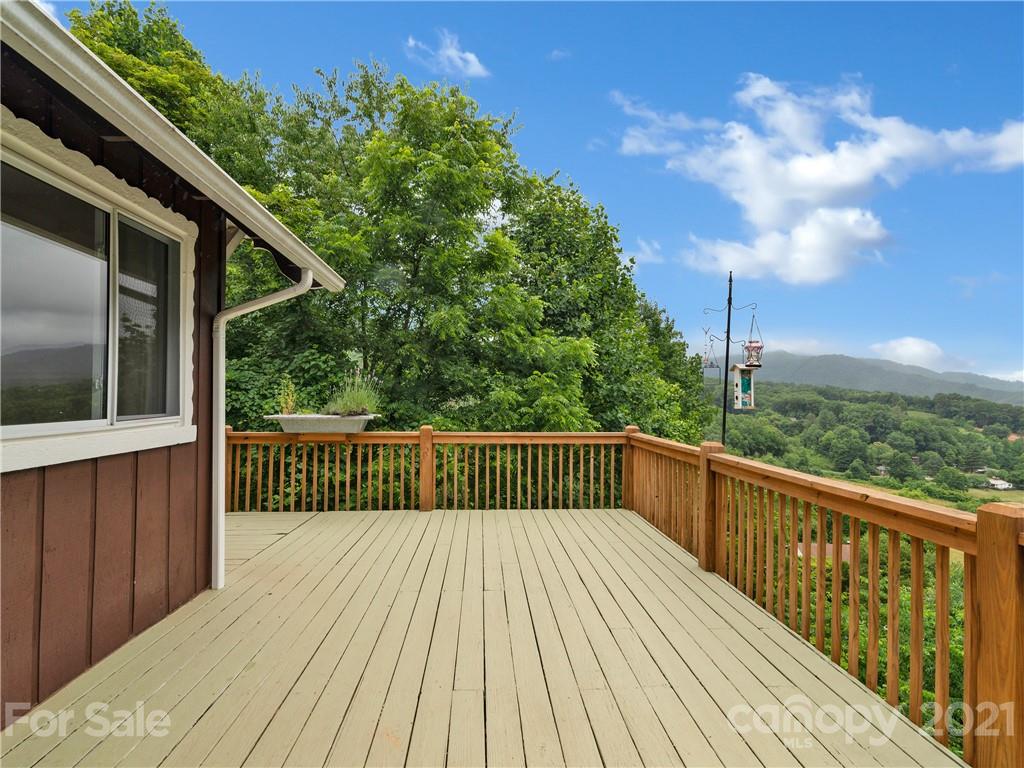 920 Hall Top Road Waynesville, NC 28786 - Photo 10 of 36 a view of balcony with wooden floor and fence