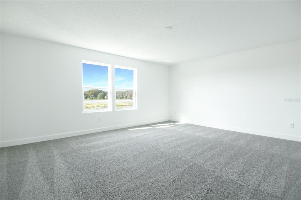 153 Waterstone Loop Tavares, FL 32778 - Photo 11 of 22 an empty room with windows