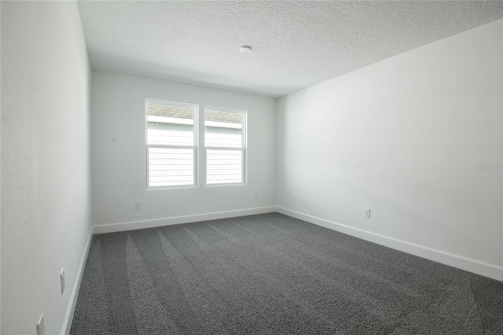 153 Waterstone Loop Tavares, FL 32778 - Photo 14 of 22 an empty room with a window