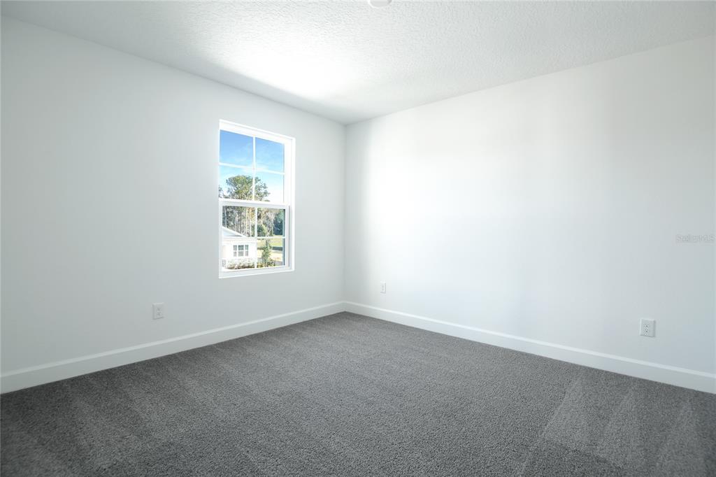 153 Waterstone Loop Tavares, FL 32778 - Photo 17 of 22 an empty room with a window