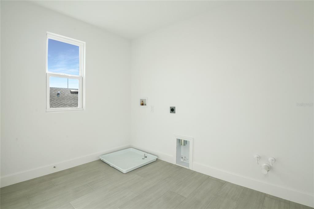 153 Waterstone Loop Tavares, FL 32778 - Photo 19 of 22 an empty room with a workbench