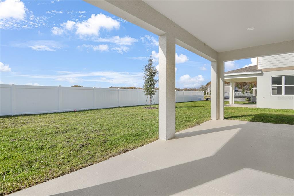 153 Waterstone Loop Tavares, FL 32778 - Photo 20 of 22 a view of a yard with an outdoor space