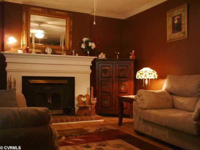 5514 Rollingway Road Chesterfield, VA 23832 - Photo 4 of 12 Living Room - Beautiful formal living room, yet cozy. Custom fireplace mantel and hearth to warm you on those chilly nights! Crown molding.