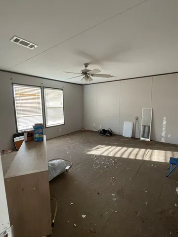 a view of a livingroom with a lounge chair