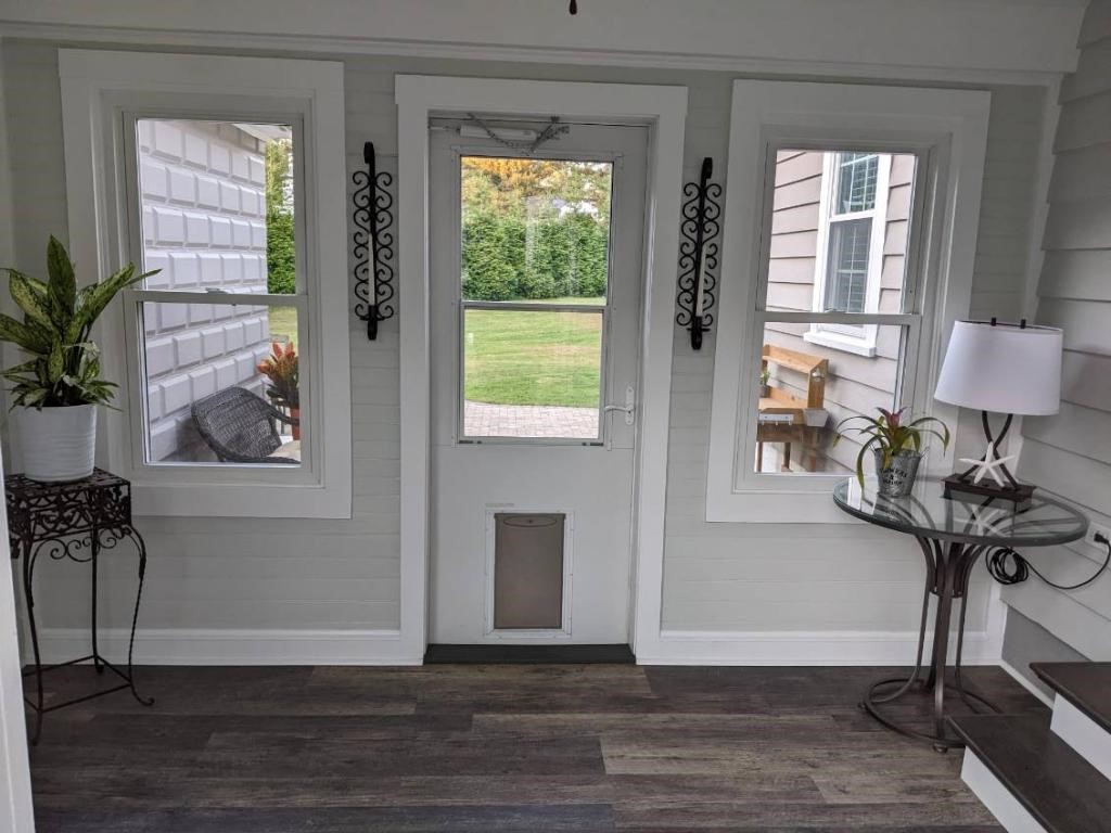 10 Orchard Valley Drive Cranston, RI 02921 - Photo 26 of 31 Mudroom/ Sunroom leading to patio / garage