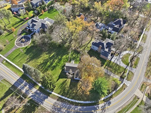 an aerial view of house with yard