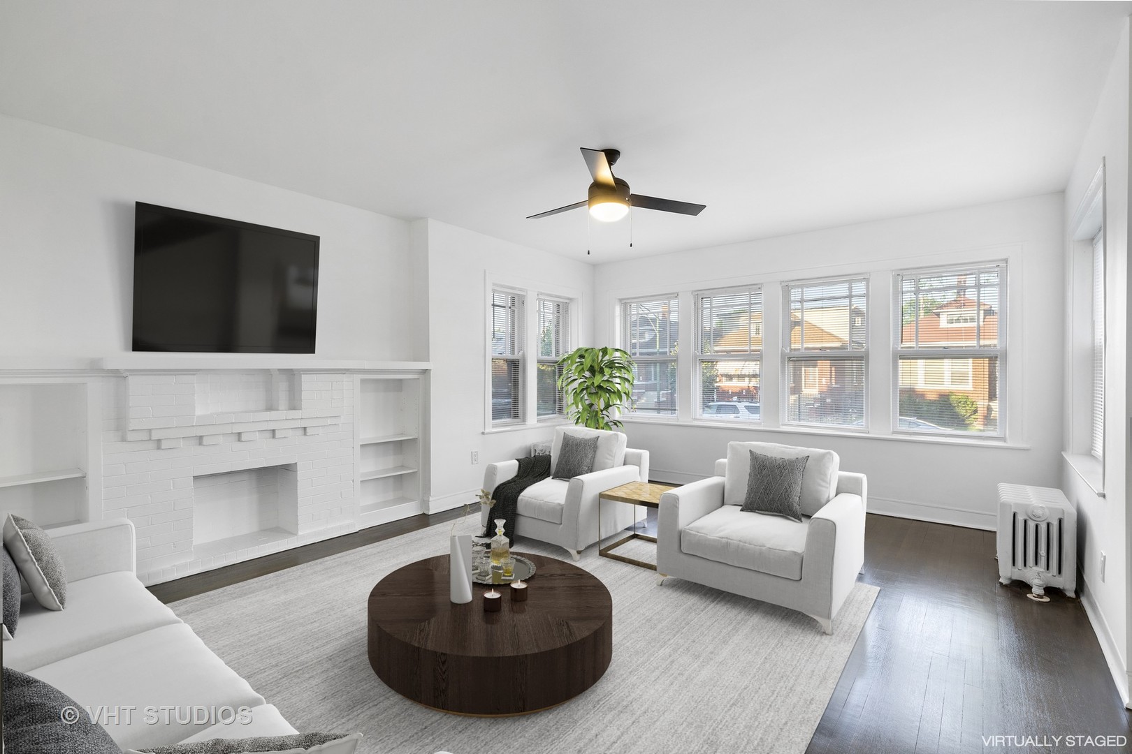 8030 South Justine Street Chicago, IL 60620 - Photo 3 of 12 a living room with furniture and a flat screen tv
