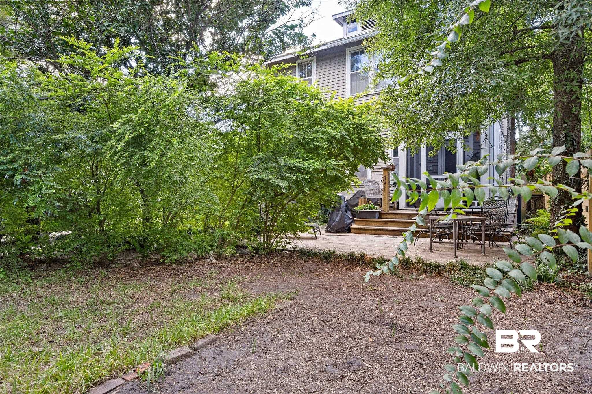 12 Lebaron Street Mobile, AL 36602 - Photo 33 of 37 View of yard featuring a wooden deck and a patio area