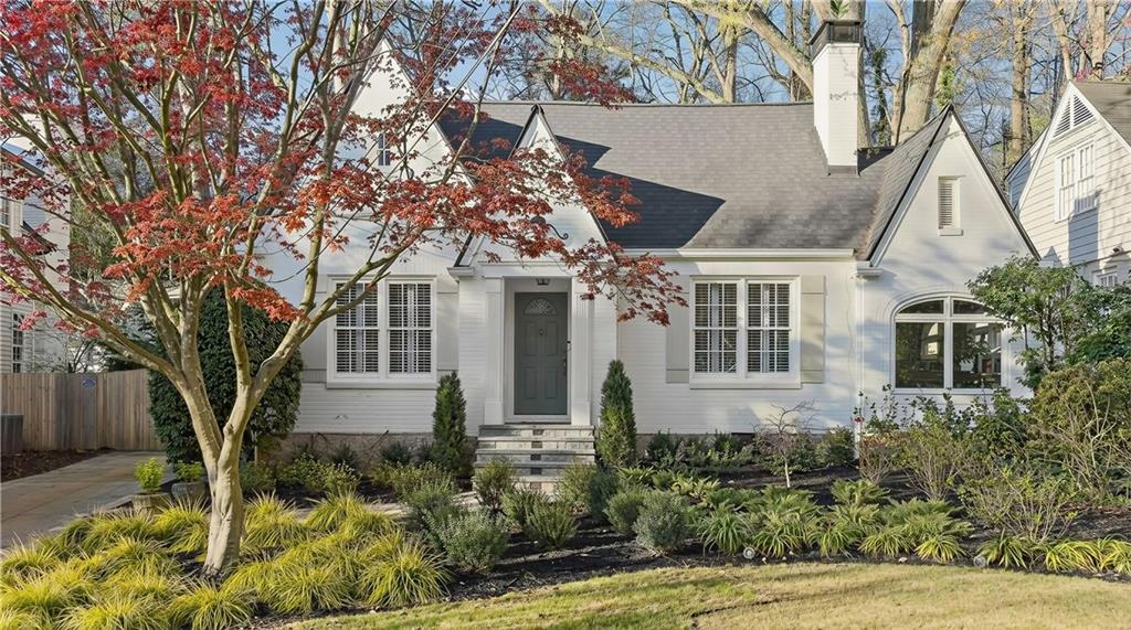 1197 Beech Valley Road Northeast Atlanta, GA 30306 - Photo 1 of 31 front view of a house with a yard