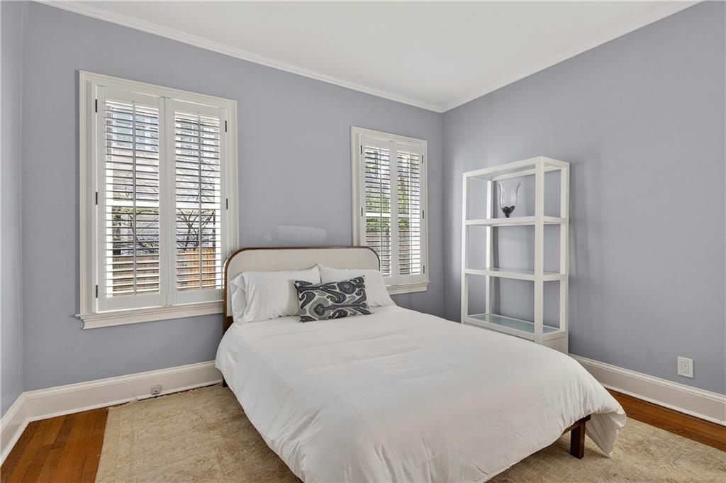 1197 Beech Valley Road Northeast Atlanta, GA 30306 - Photo 21 of 31 a bedroom with a bed and a window