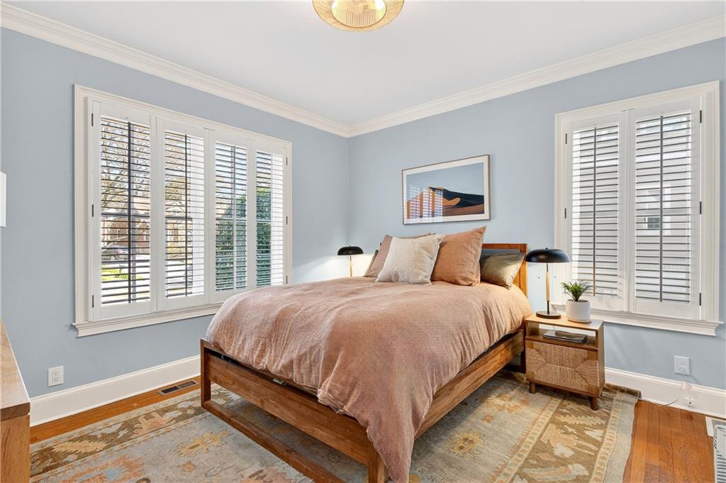 1197 Beech Valley Road Northeast Atlanta, GA 30306 - Photo 23 of 31 a spacious bedroom with a bed and a window