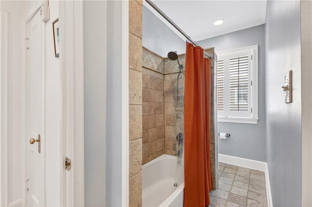 1197 Beech Valley Road Northeast Atlanta, GA 30306 - Photo 25 of 31 a bathroom with a shower and a tub