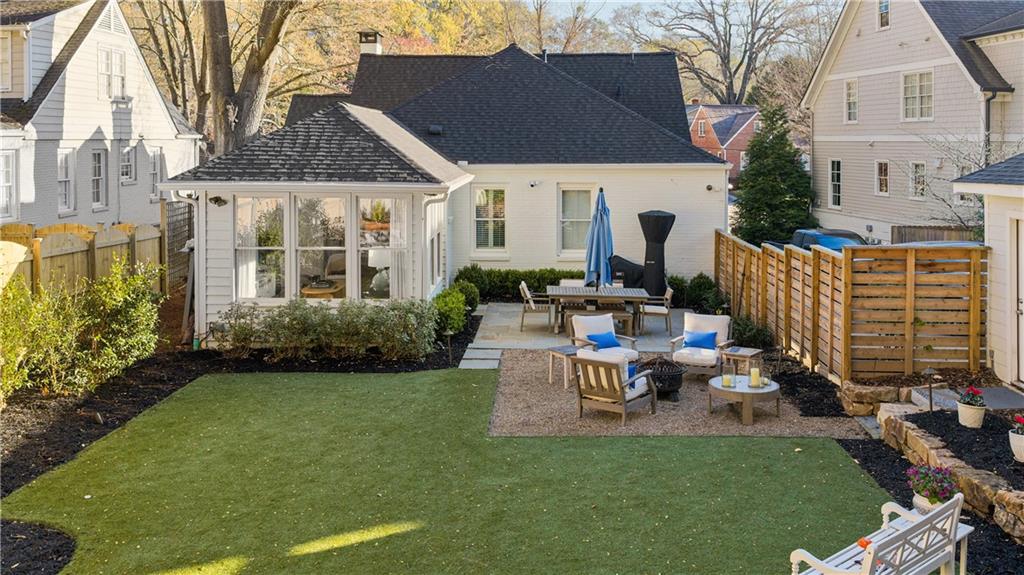 1197 Beech Valley Road Northeast Atlanta, GA 30306 - Photo 26 of 31 a view of a patio with table and chairs potted plants and a large tree
