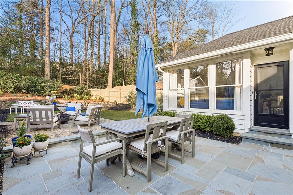 1197 Beech Valley Road Northeast Atlanta, GA 30306 - Photo 27 of 31 a view of a patio with a table and chairs and potted plants