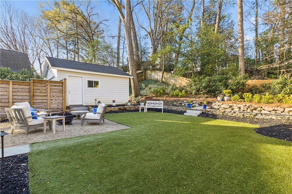 1197 Beech Valley Road Northeast Atlanta, GA 30306 - Photo 29 of 31 a view of a backyard with sitting area