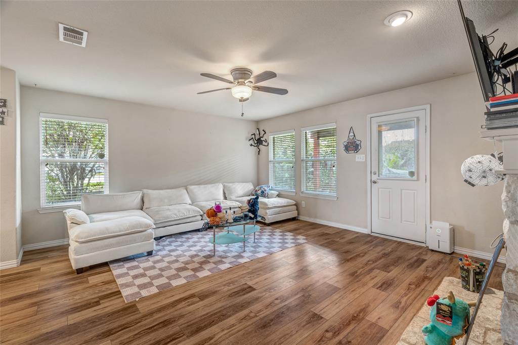 3216 Jetranger Road Fort Worth, TX 76053 - Photo 17 of 35 Living room featuring plenty of natural light, light wood-style floors, and a ceiling fan