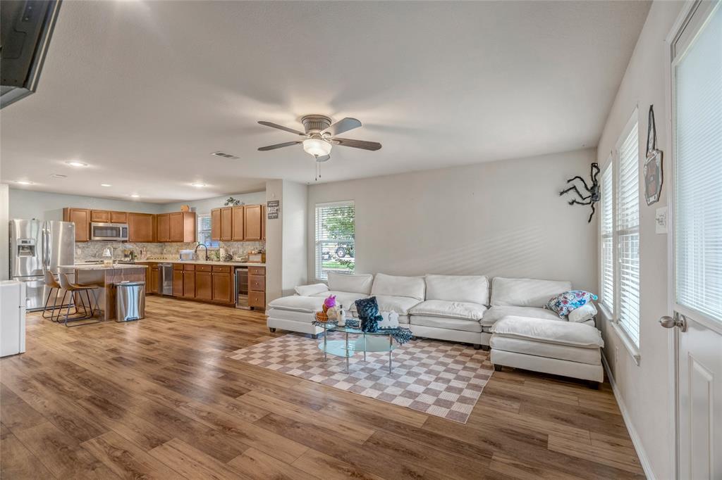 3216 Jetranger Road Fort Worth, TX 76053 - Photo 18 of 35 Living area with light wood-type flooring, ceiling fan, and beverage cooler