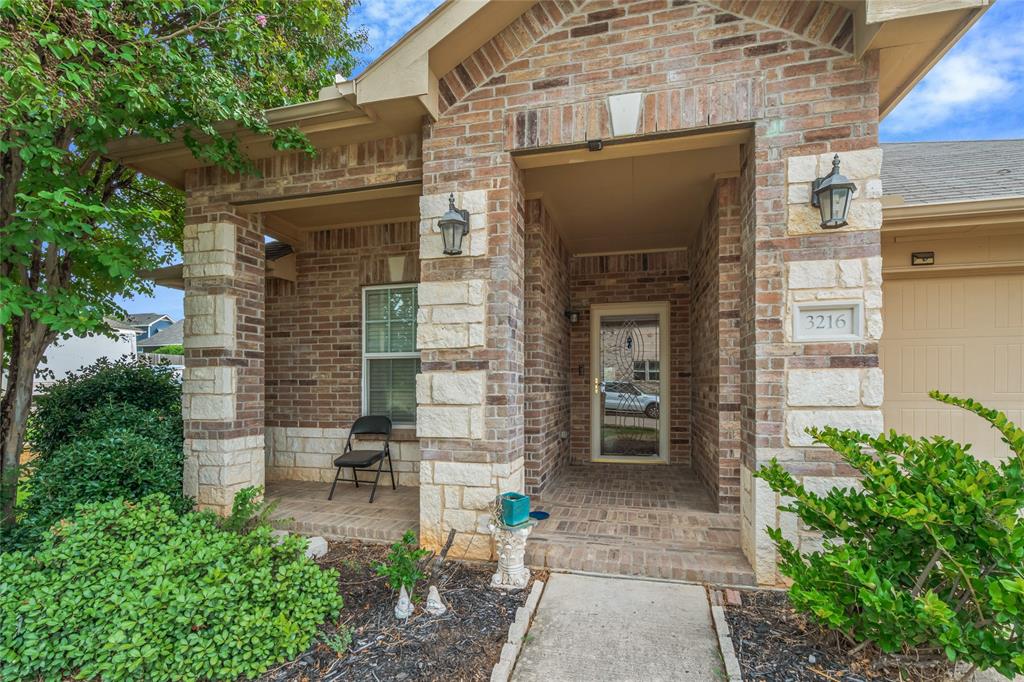 3216 Jetranger Road Fort Worth, TX 76053 - Photo 2 of 35 Doorway to property with brick siding and a porch