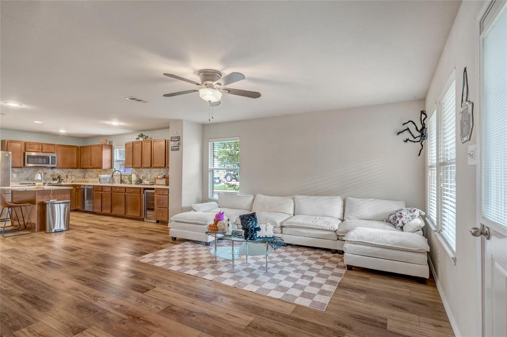 3216 Jetranger Road Fort Worth, TX 76053 - Photo 19 of 35 Living area featuring ceiling fan, light wood-type flooring, and beverage cooler