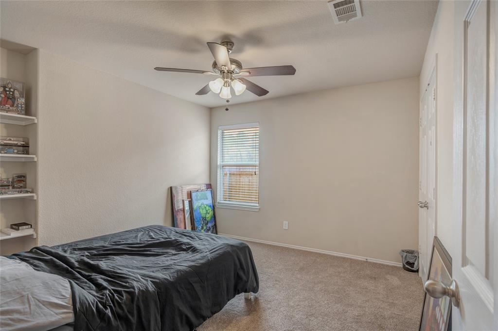 3216 Jetranger Road Fort Worth, TX 76053 - Photo 21 of 35 Bedroom with carpet floors and ceiling fan